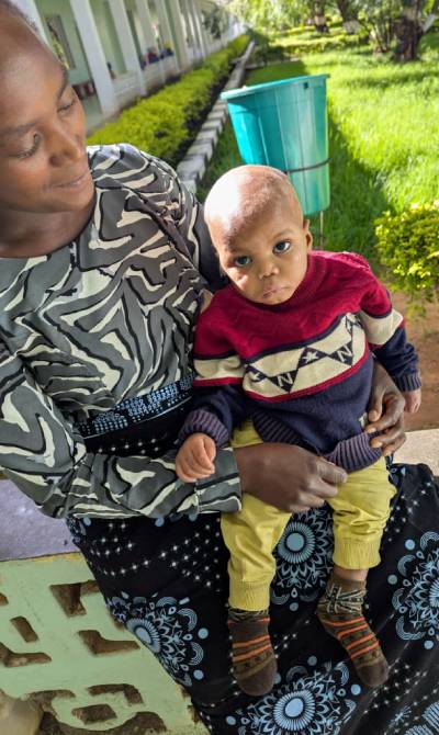 Moses with one of his caregiver during hospitalization at Tosamaganga Hospital